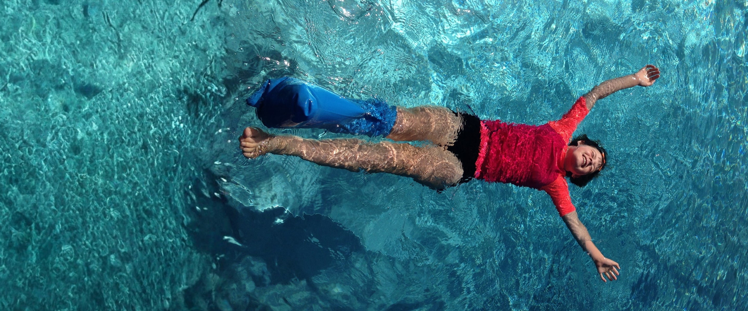 Bloccs waterproof cast cover being used in water
