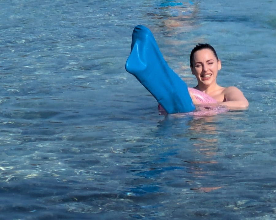 Customer swimming in a Bloccs leg cover